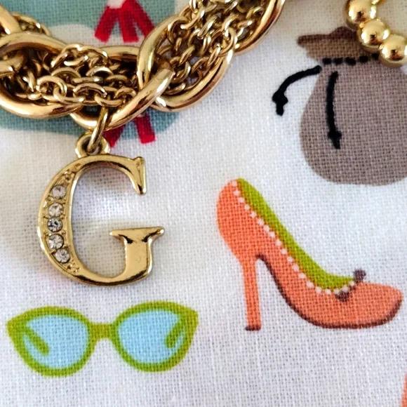 Guess Gold-Tone Romantic Charm Bracelet - Picture 2 of 10